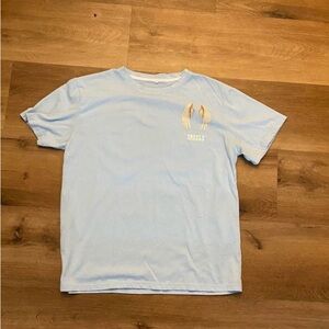 Light blue L graphic T